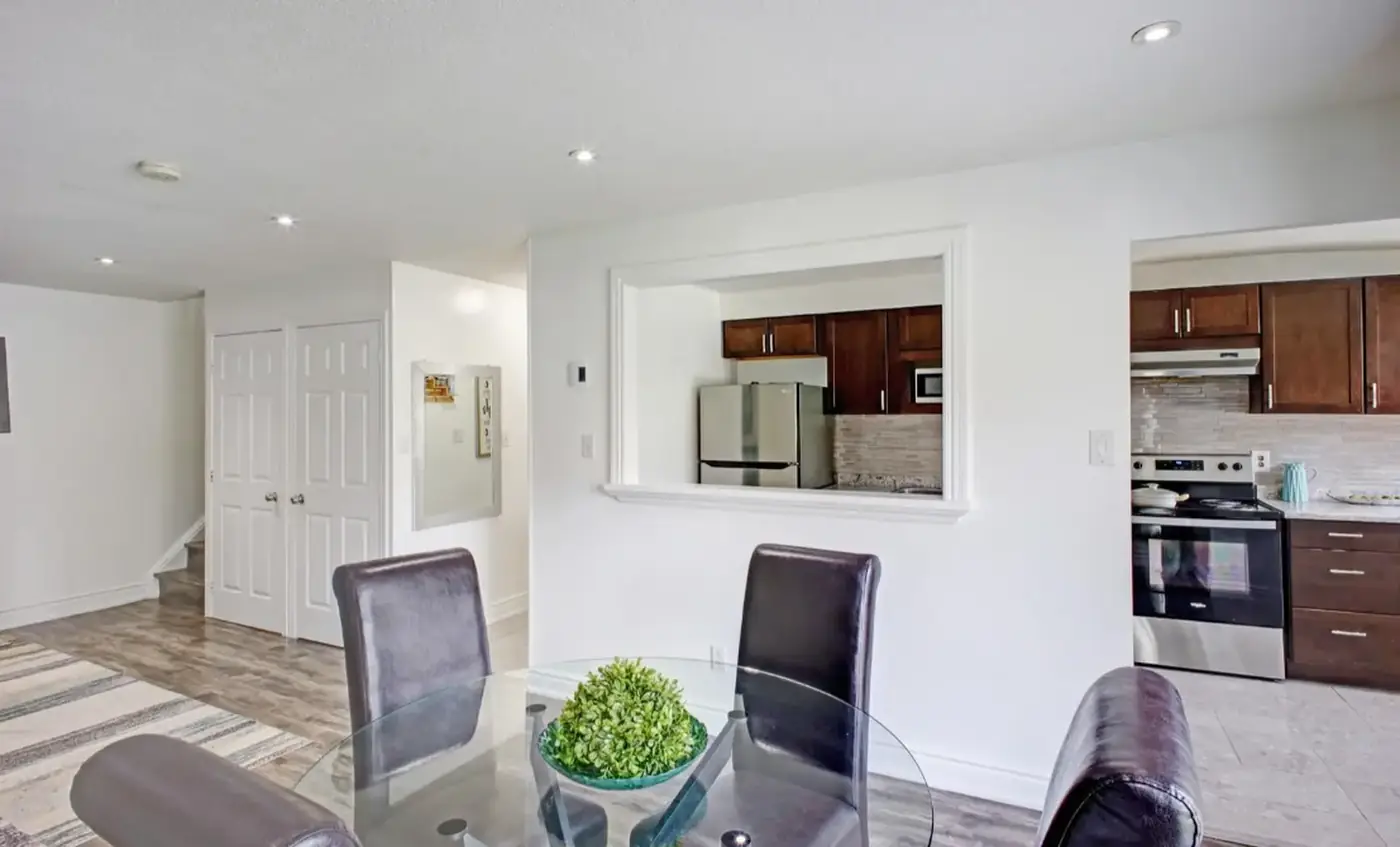 Open-concept dining area with a pass-through to the kitchen