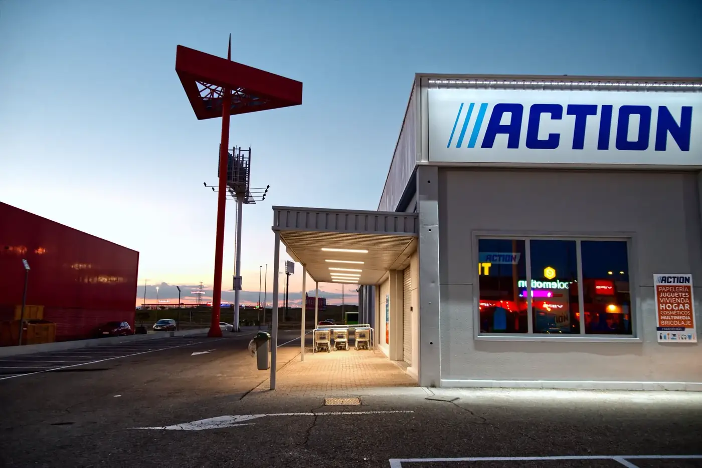 A multi-tenant commercial building with illuminated signage