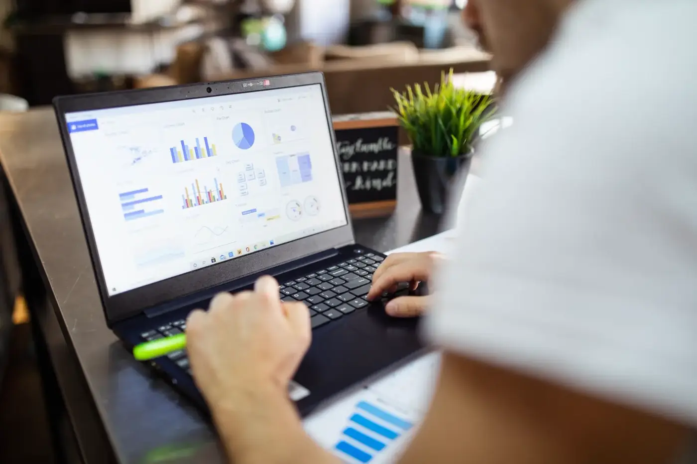 Charts and financial analysis on a laptop screen